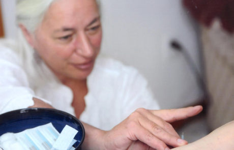a patient receiving an acupuncture treatment from Sharon